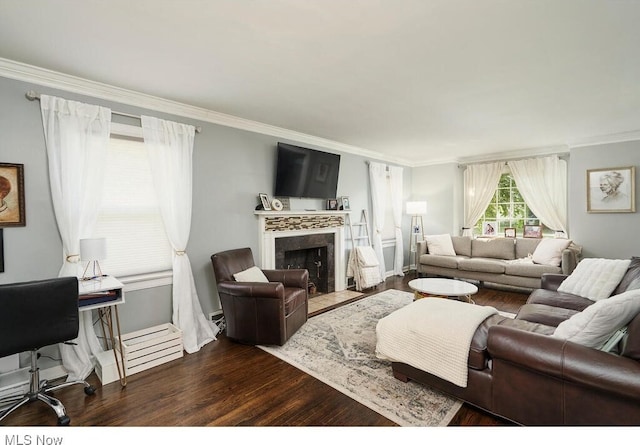 living room with a premium fireplace, dark wood-type flooring, and ornamental molding