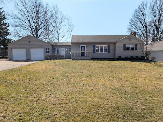 ranch-style house featuring driveway, a front lawn, and a garage