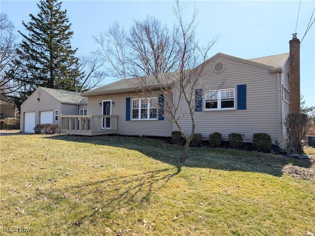 rear view of house featuring a deck, a lawn, an outdoor structure, and a chimney