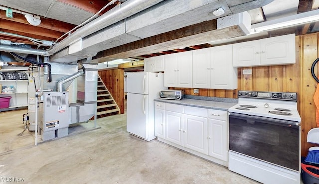 kitchen with a toaster, white appliances, white cabinetry, and concrete floors