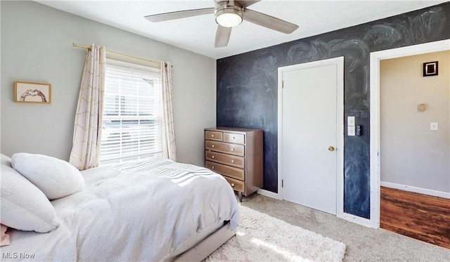 bedroom with baseboards, carpet floors, and ceiling fan