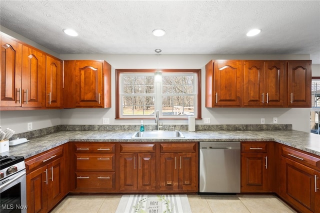 kitchen featuring a sink, appliances with stainless steel finishes, recessed lighting, and light tile patterned floors