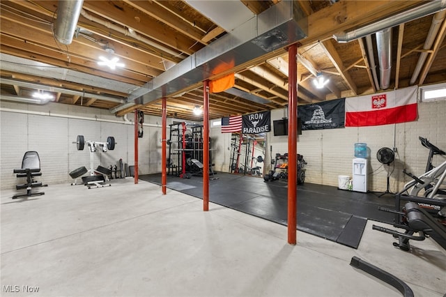 workout room with brick wall