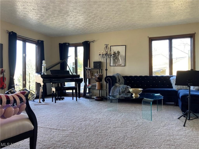 carpeted living room featuring a textured ceiling