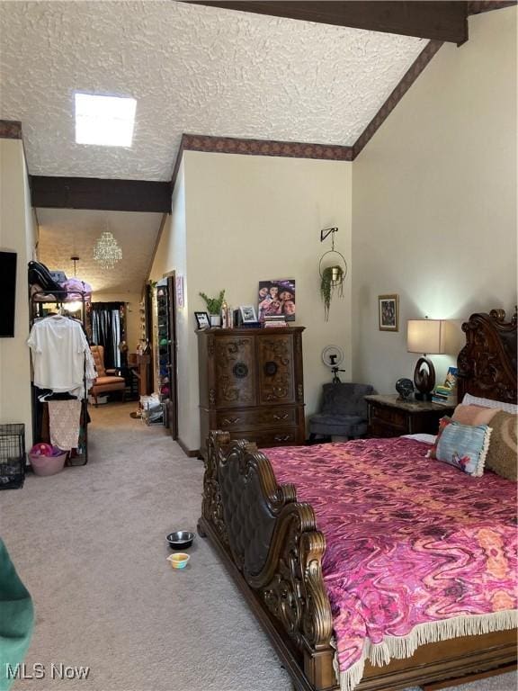 bedroom featuring a textured ceiling, vaulted ceiling with beams, and carpet floors