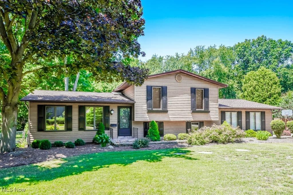 split level home with a front yard