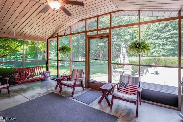 unfurnished sunroom featuring vaulted ceiling and ceiling fan