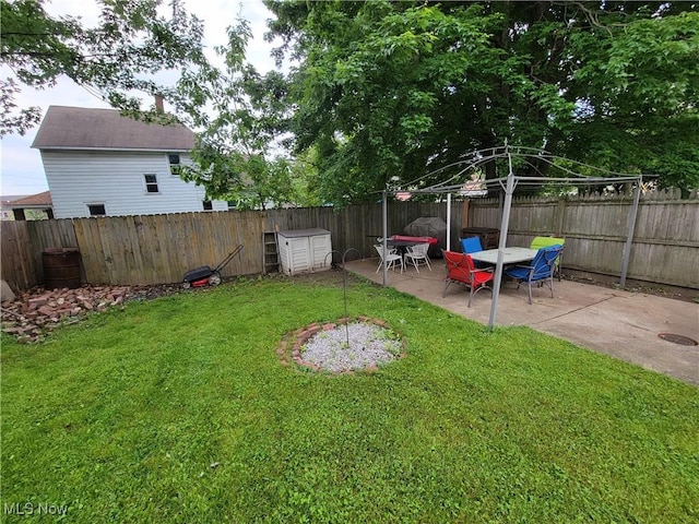 view of yard featuring a patio area and a fenced backyard