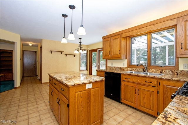 kitchen featuring a kitchen island, black dishwasher, light stone counters, brown cabinetry, and a sink