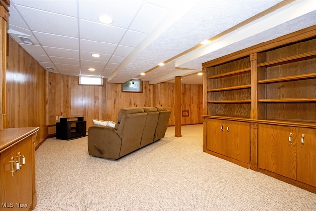 living room with recessed lighting, visible vents, light carpet, and wooden walls