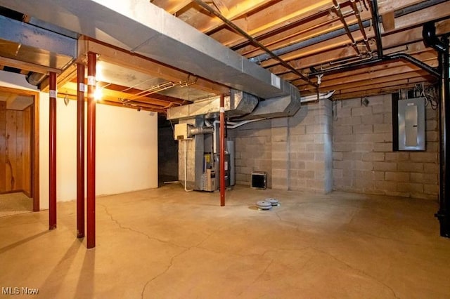 unfinished basement featuring heating unit and electric panel