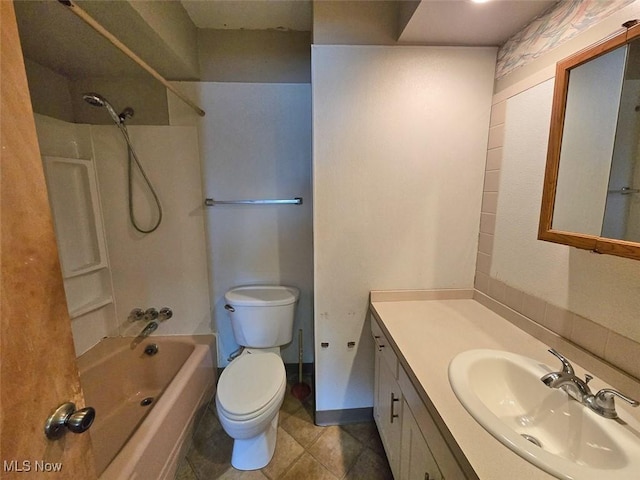 full bath with vanity, washtub / shower combination, baseboards, tile patterned flooring, and toilet