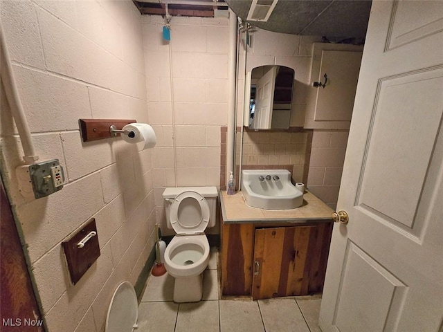 bathroom featuring tile patterned floors, tasteful backsplash, toilet, and vanity