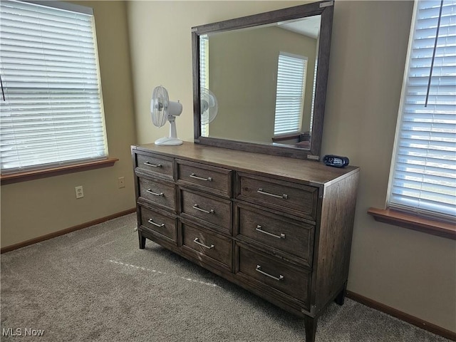 carpeted bedroom featuring baseboards