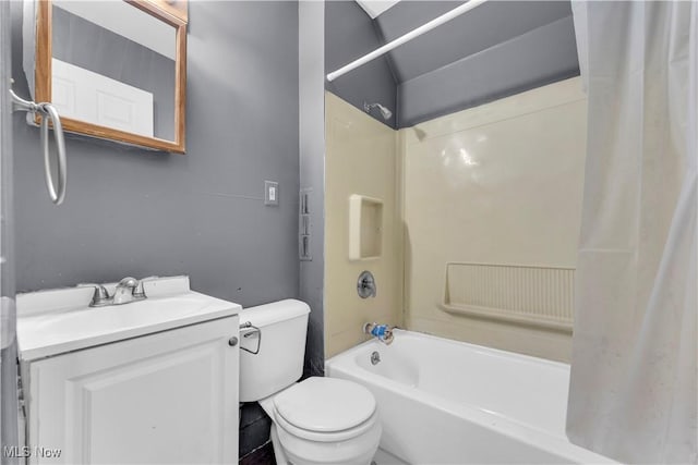 bathroom with toilet, shower / bath combo with shower curtain, and vanity