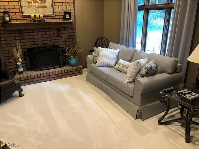 living room featuring a brick fireplace and carpet floors