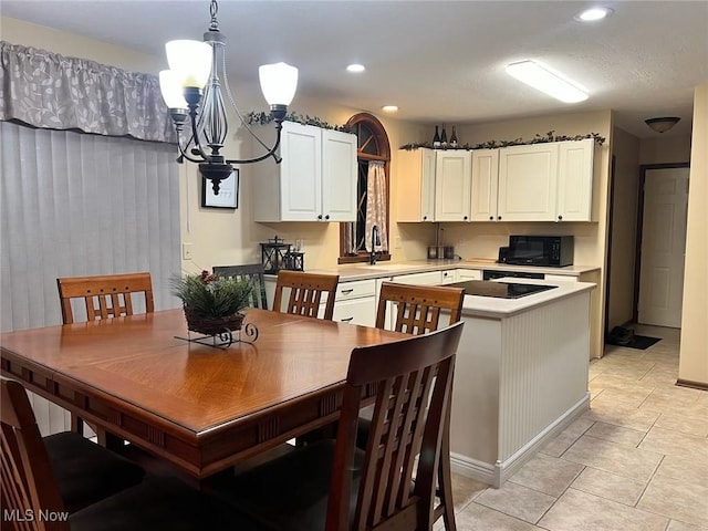 dining space with an inviting chandelier, light tile patterned floors, and recessed lighting