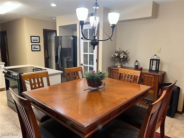 dining space with a notable chandelier, light tile patterned flooring, and recessed lighting