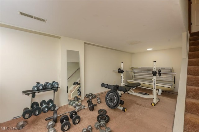 exercise room with visible vents and carpet floors