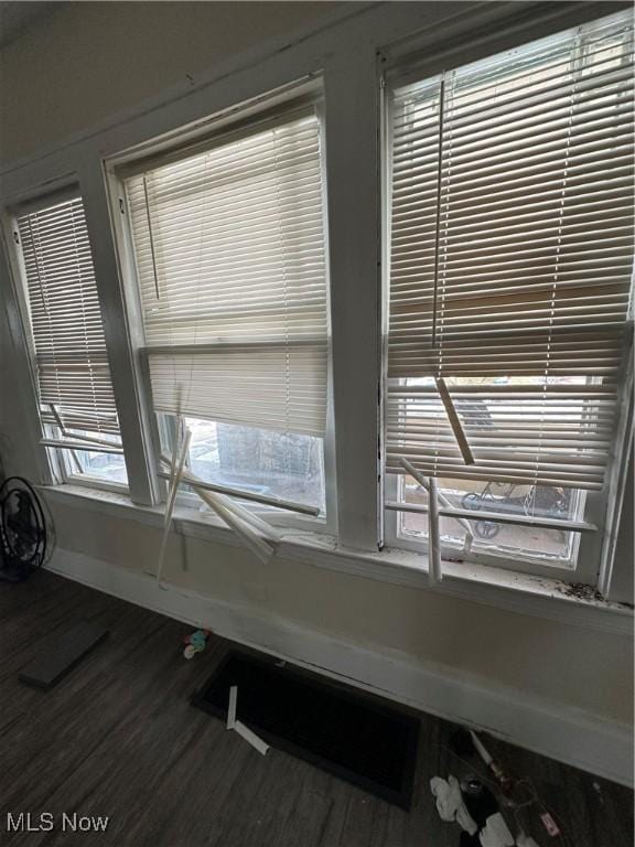 interior details with wood finished floors and baseboards