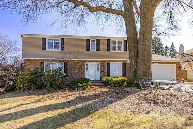 colonial home with a garage