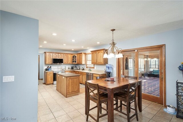 dining area featuring a wealth of natural light, recessed lighting, and light tile patterned floors