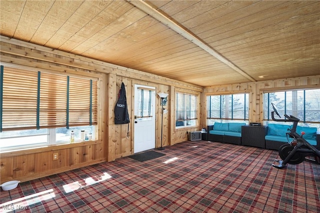 unfurnished sunroom featuring wood ceiling and a healthy amount of sunlight