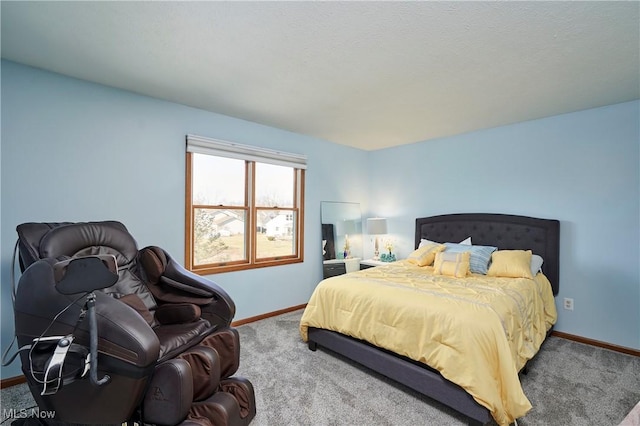 carpeted bedroom featuring baseboards