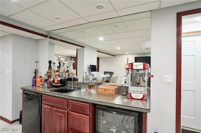 bar featuring beverage cooler, a drop ceiling, black dishwasher, indoor wet bar, and a sink