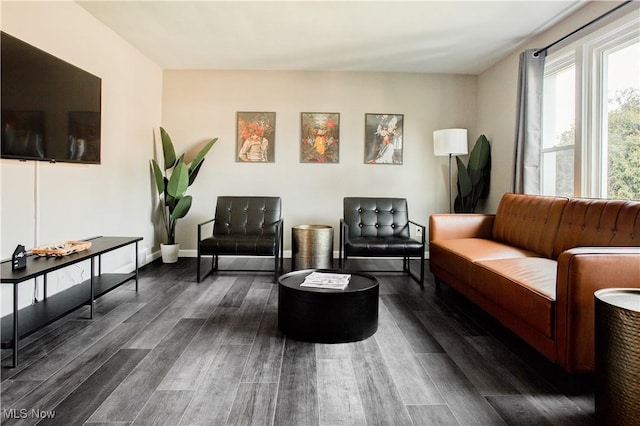2448 Warrensville Center Rd, University Heights, OH 44118 - living room featuring baseboards and dark wood-style floors