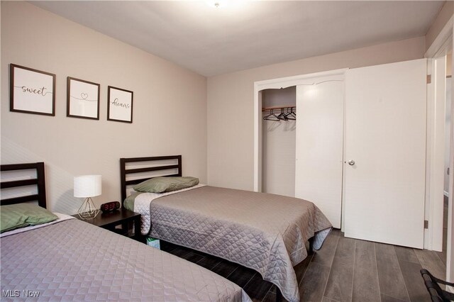 2448 Warrensville Center Rd, University Heights, OH 44118 - bedroom with a closet and dark wood-style floors