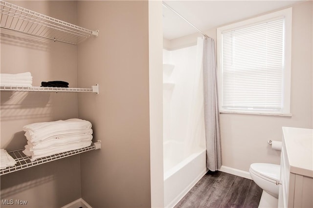 2448 Warrensville Center Rd, University Heights, OH 44118 - bathroom with toilet, shower / tub combo with curtain, wood finished floors, baseboards, and vanity