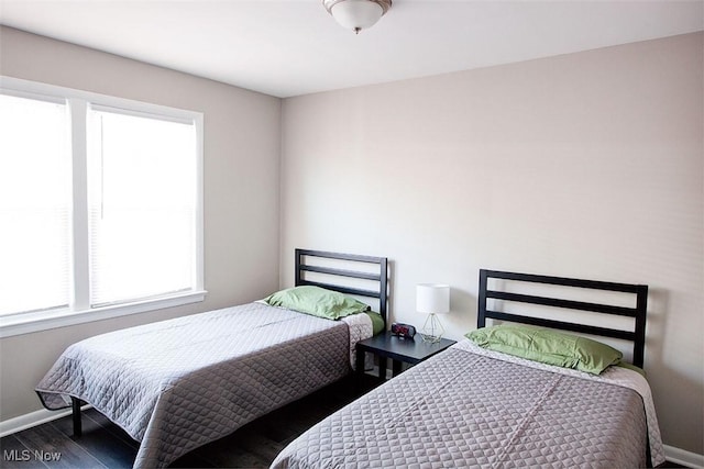 2448 Warrensville Center Rd, University Heights, OH 44118 - bedroom featuring baseboards and wood finished floors