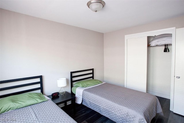 2448 Warrensville Center Rd, University Heights, OH 44118 - bedroom with a closet and dark wood-style flooring