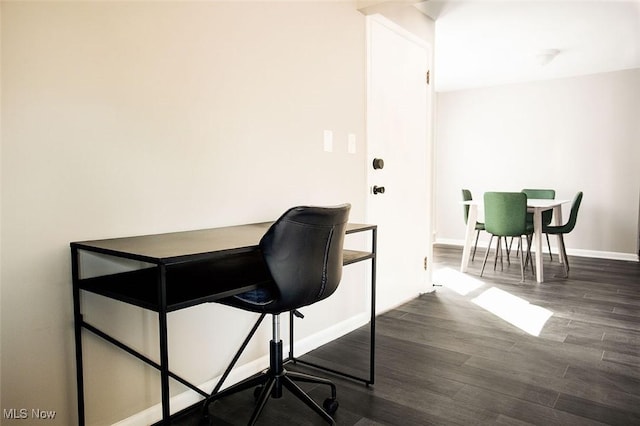 2448 Warrensville Center Rd, University Heights, OH 44118 - home office featuring dark wood-style floors and baseboards