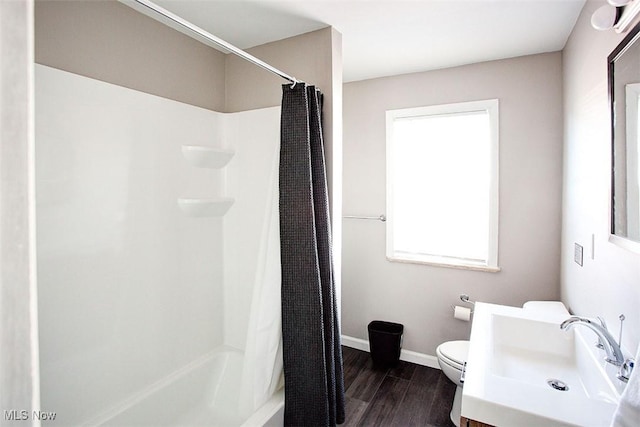 2448 Warrensville Center Rd, University Heights, OH 44118 - full bathroom featuring baseboards, toilet, wood finished floors, and vanity