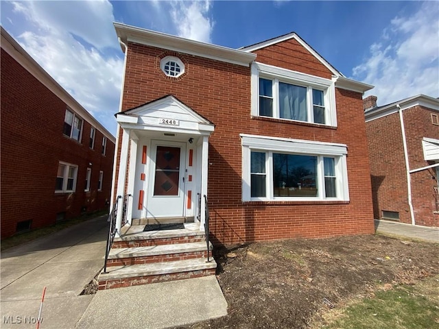 view of front of home with brick siding