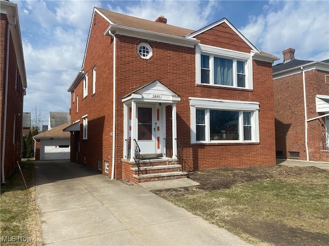 2448 Warrensville Center Rd, University Heights, OH 44118 - view of front of home with a garage, brick siding, and a chimney