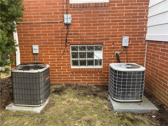 2448 Warrensville Center Rd, University Heights, OH 44118 - details with cooling unit and brick siding