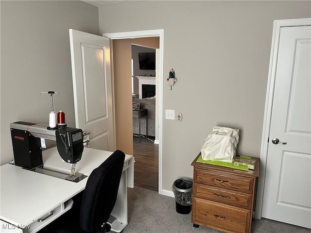 home office with baseboards and carpet floors