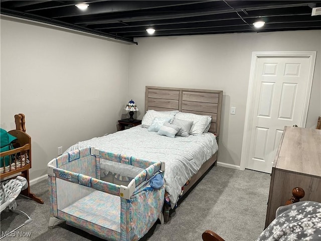 bedroom featuring baseboards and carpet floors