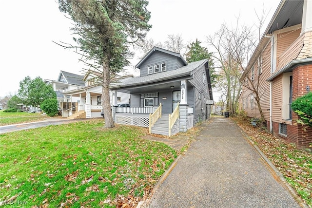 view of front of property with a porch and a front yard