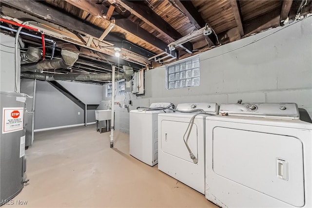 laundry area with a sink, laundry area, and washing machine and clothes dryer