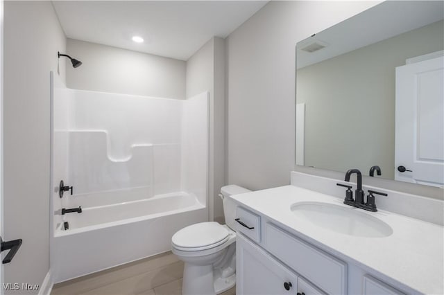 full bathroom featuring toilet, vanity, shower / washtub combination, and tile patterned floors