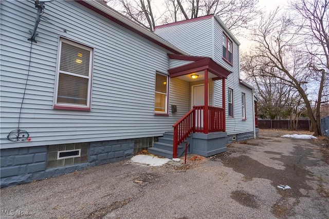 view of side of home with fence