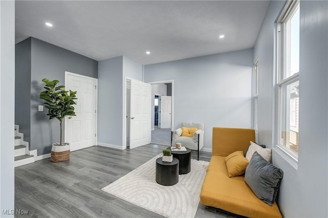 living room with stairway, recessed lighting, wood finished floors, and baseboards