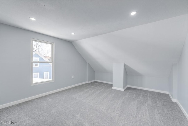 bonus room with recessed lighting, baseboards, lofted ceiling, and carpet floors