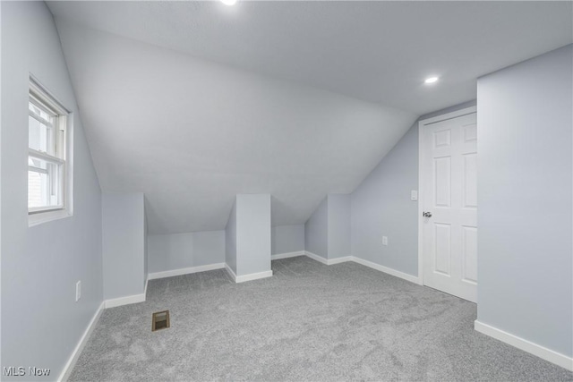 bonus room featuring visible vents, baseboards, and carpet flooring