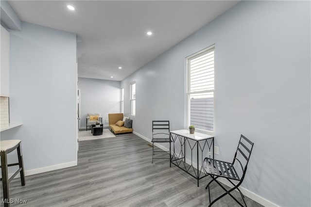 sitting room with recessed lighting, baseboards, and wood finished floors