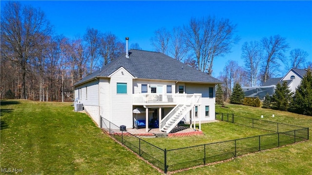 back of house with cooling unit, a wooden deck, a yard, a fenced backyard, and stairs